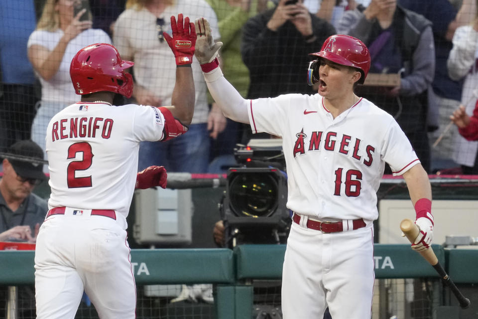 Los Angeles Angels' Luis Rengifo (2) celebrates with Mickey Moniak (16) after hitting a home run during the fifth inning of a baseball game against the Chicago Cubs in Anaheim, Calif., Wednesday, June 7, 2023. (AP Photo/Ashley Landis)