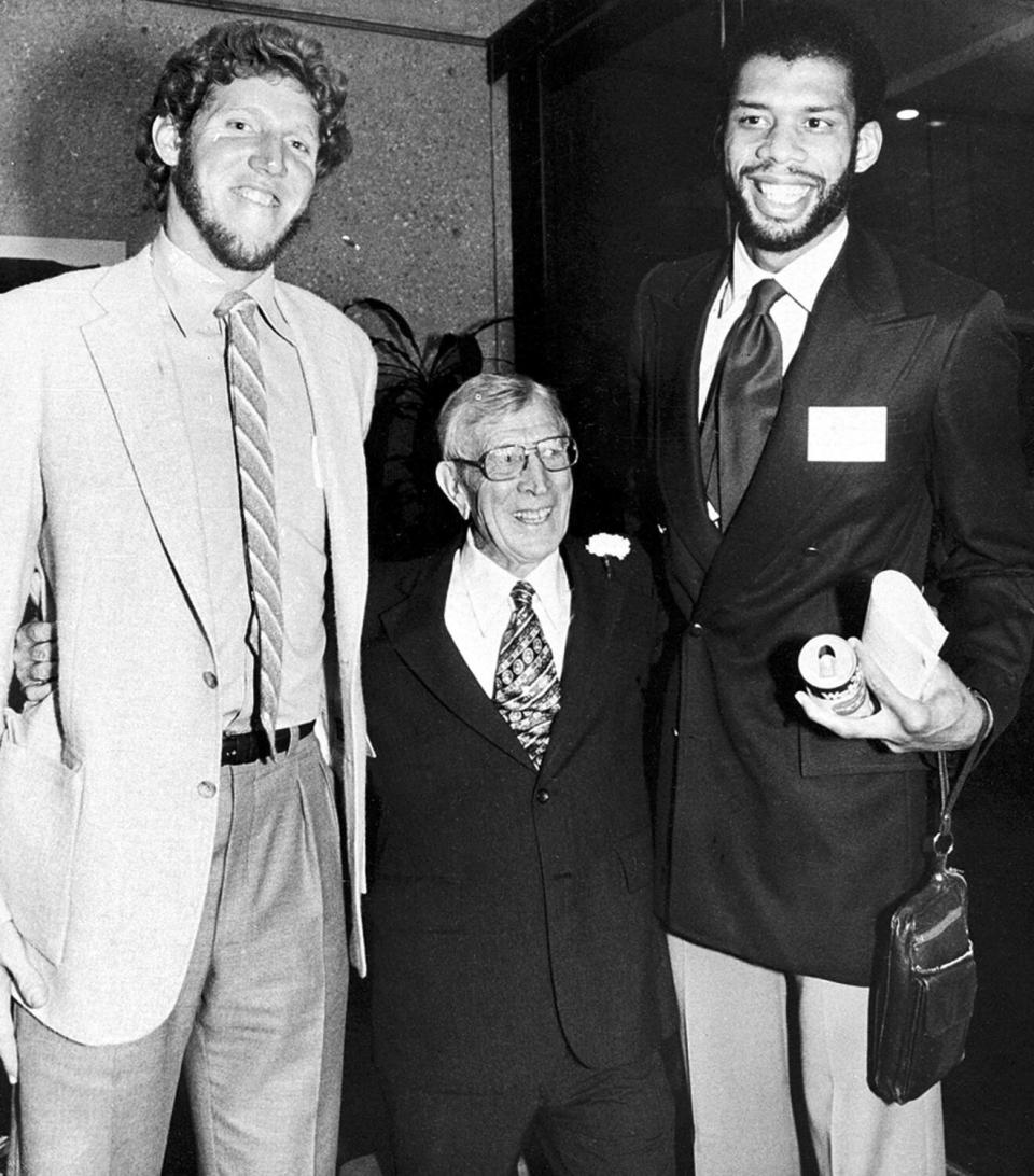 Former UCLA coach John Wooden is flanked by Bill Walton and Kareem Abdul-Jabbar