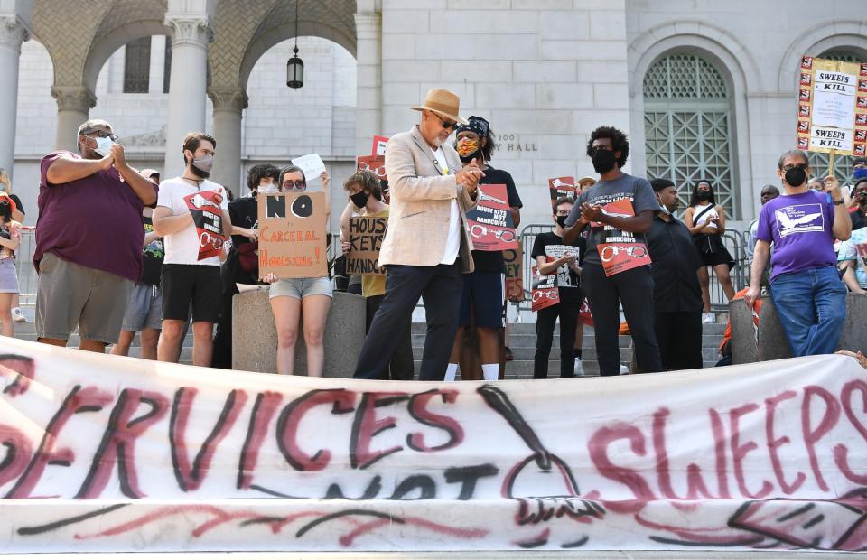 People rally outside L.A. City Hall,