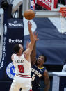 Chicago Bulls guard Zach LaVine (8) shoots over New Orleans Pelicans guard Eric Bledsoe (5) during the first half of an NBA basketball game in New Orleans, Wednesday, March 3, 2021. (AP Photo/Gerald Herbert)