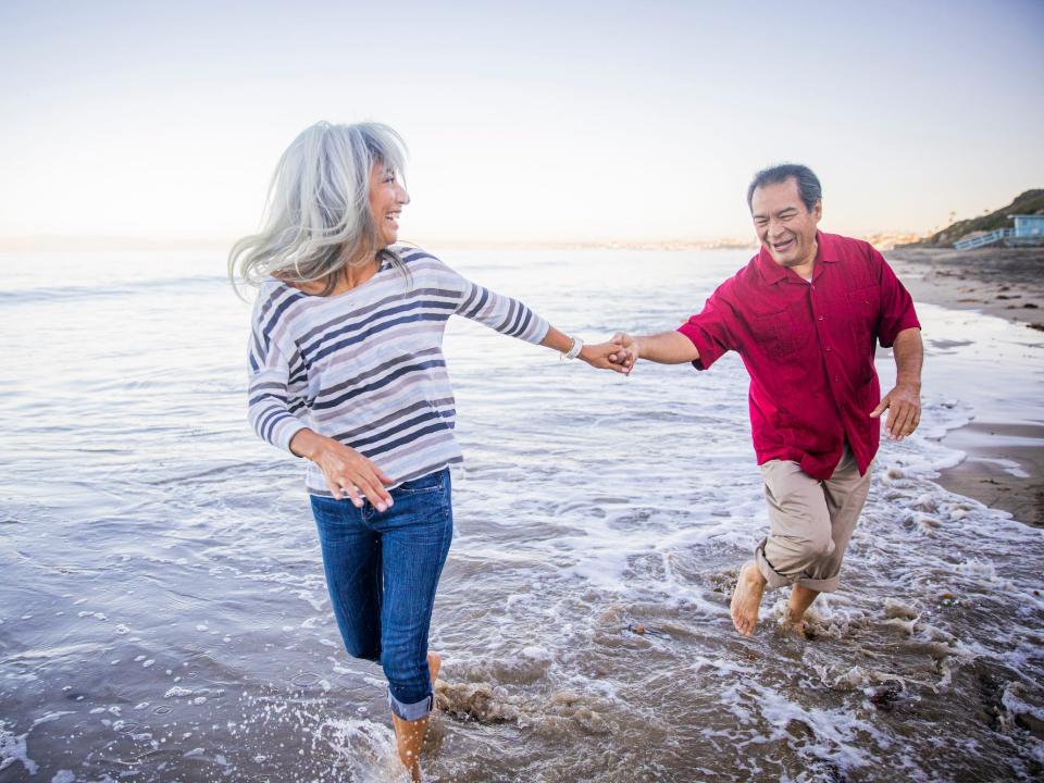 A couple walking along the beach