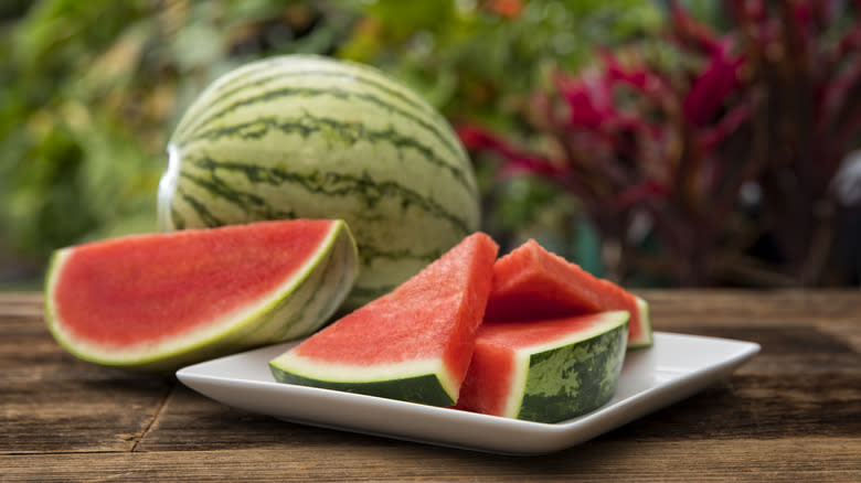 whole and sliced watermelon