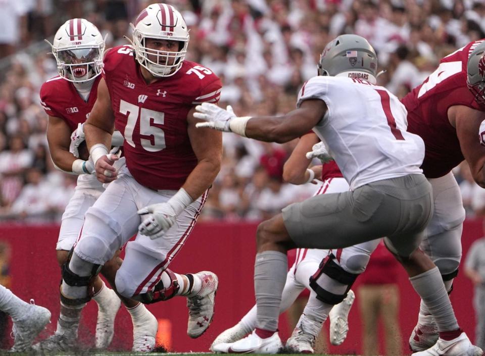 Wisconsin offensive lineman Joe Tippmann (75) looks to clear a path during the third quarter of their game Saturday, September 10, 2022 at Camp Randall Stadium in Madison, Wis. Washington State beat Wisconsin 17-14.