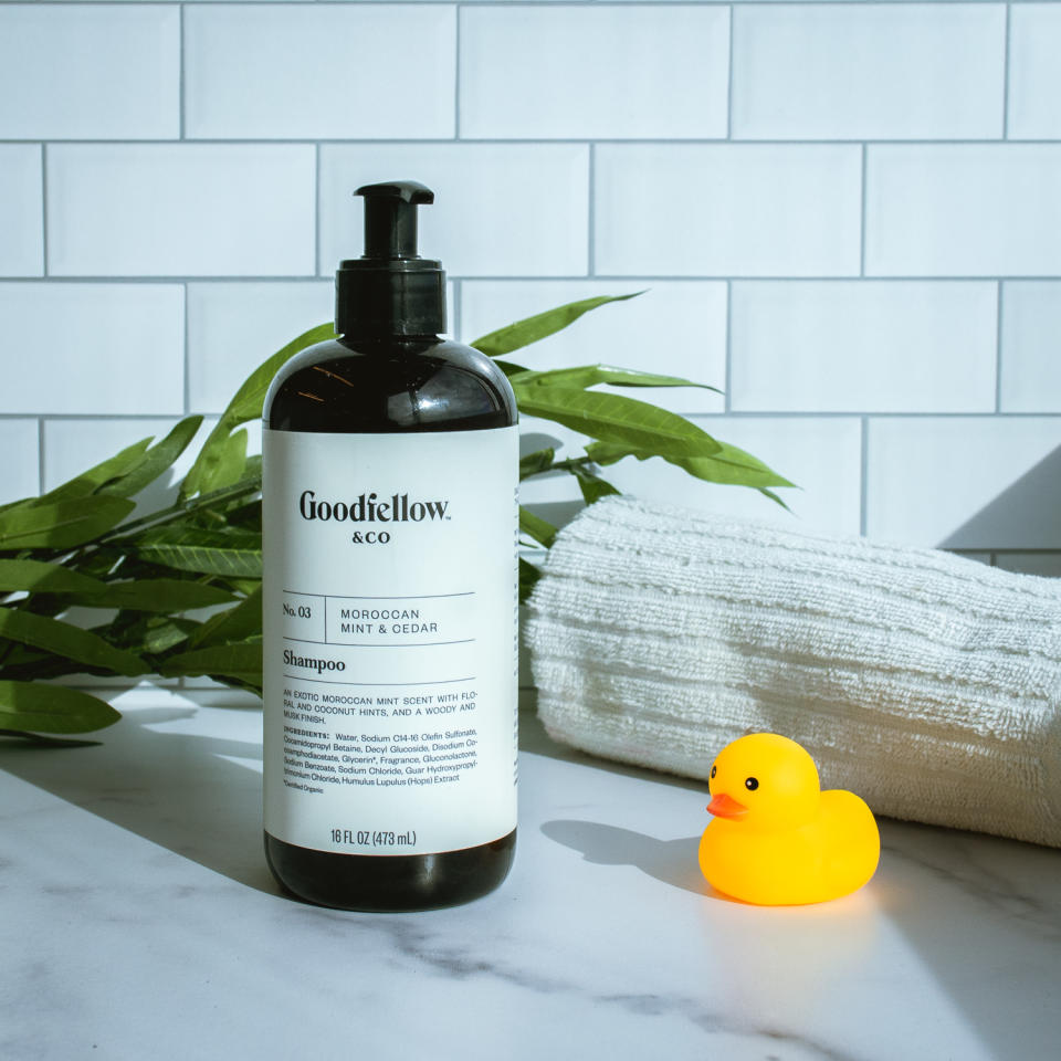 goodfellow shampoo on marble with tile background with rubber duckie