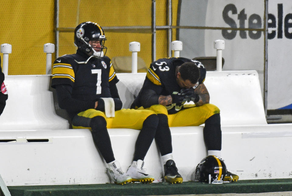 Pittsburgh Steelers quarterback Ben Roethlisberger (7) sits on the bench next to center Maurkice Pouncey (53) following a 48-37 loss to the Cleveland Browns in an NFL wild-card playoff football game in Pittsburgh, Sunday, Jan. 10, 2021. (AP Photo/Don Wright)