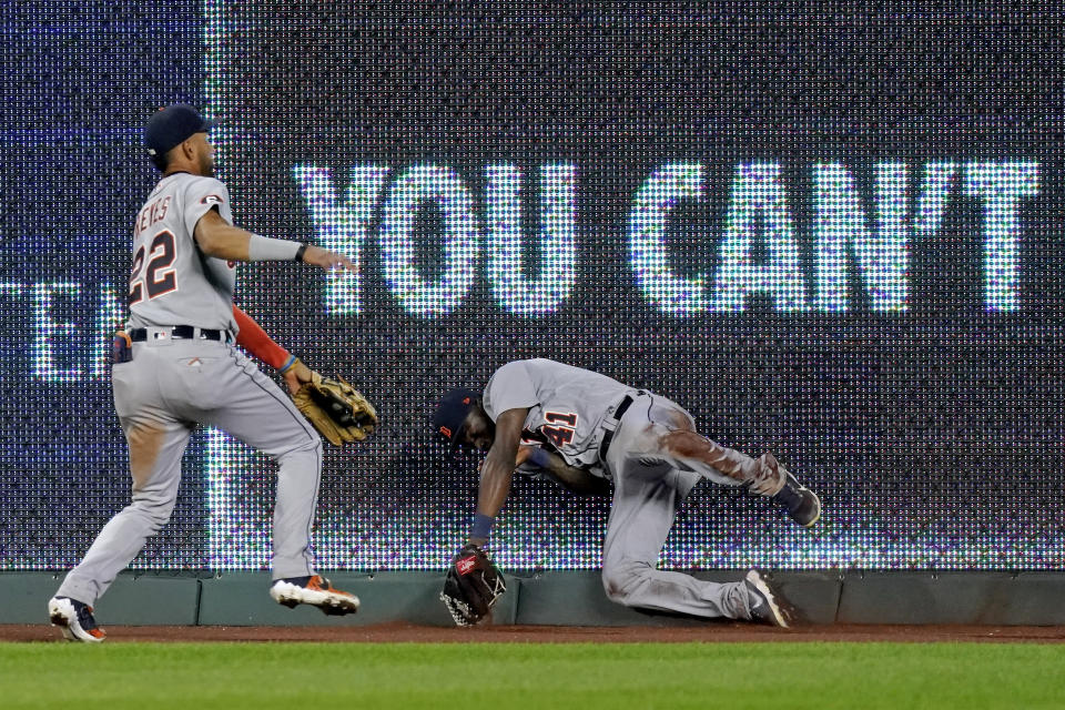 Detroit Tigers center fielder Victor Reyes (22) and right fielder Daz Cameron (41) try to field an RBI double hit by Kansas City Royals' Jorge Soler during the sixth inning of a baseball game Thursday, Sept. 24, 2020, in Kansas City, Mo. (AP Photo/Charlie Riedel)