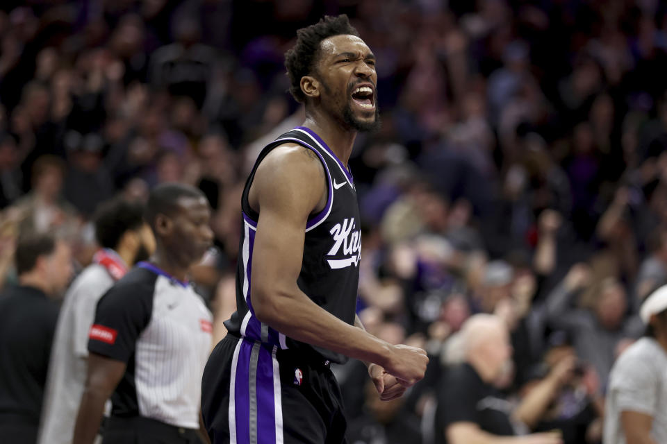 Sacramento Kings guard Malik Monk celebrates the team's win over the San Antonio Spurs in an NBA basketball game in Sacramento, Calif, Thursday, March 7, 2024. (AP Photo/Jed Jacobsohn)