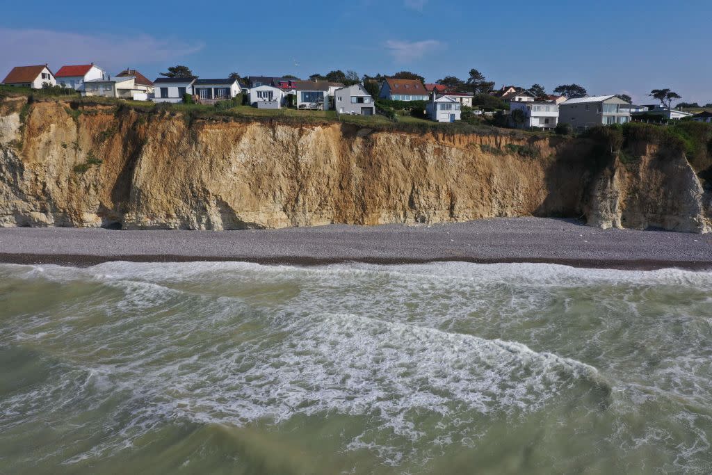 Global warming, accompanied by rising sea levels, increases risk of flooding, erosion, and cliff collapse on the Normandy coast in France, as shown on June 22, 2022.