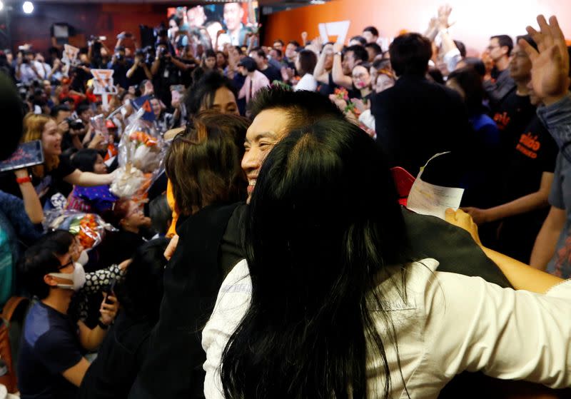Supporter hugs Future Forward Party leader Thanathorn Juangroongruangkit as he arrives to give a speech, at the party's headquarters in Bangkok
