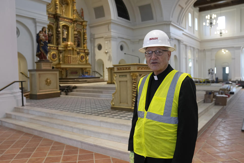 Rev. Don Wolf, a cousin of the Blessed Stan Rother, stands in the main church at the Blessed Stanley Rother Shrine, Thursday, Feb. 2, 2023, in Oklahoma City. Wolf will serve as the shrine's first rector. (AP Photo/Sue Ogrocki)