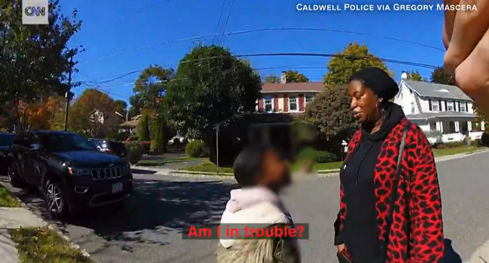 A 9-year-old Black girl and her mother, Monique Joseph, were approached by a police officer after a neighbour called 911 on the young girl after he saw her spraying the grass to fend off an invasive species in the area (CNN/Caldwell Police/video screengrab)