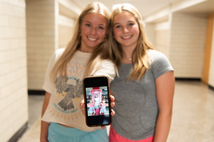 Mallory O’Dell and a friend showing an old photo of them in front of a Kelsea Ballerini poster (Courtesy of Knox County Schools).