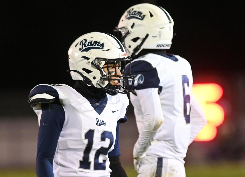 Rochester quarterback Jayden Norman reacts after a Rams touchdown in the second quarter of Friday night's game at Laurel.