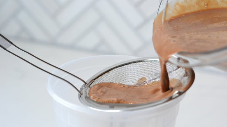 chocolate pudding in strainer