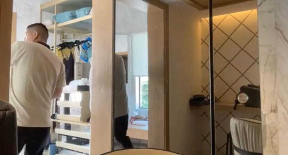 A housekeeper was busted for going through a hotel guest's room and taking a beer from the fridge. Source: TikTok/arturbo86