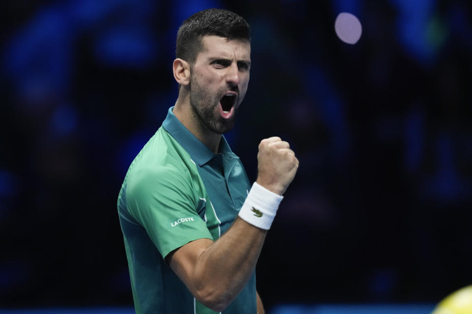 Serbia's Novak Djokovic reacts after defeating Spain's Carlos Alcaraz in their singles semifinal tennis match of the ATP World Tour Finals at the Pala Alpitour, in Turin, Italy, Saturday, Nov. 18, 2023. (AP Photo/Antonio Calanni)