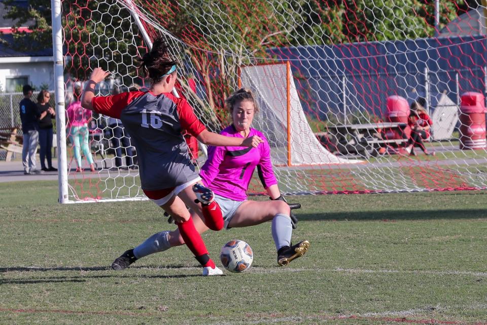 New Bern goalkeeper Chloe Leffler tries to stop Jacksonville's Landyn Wessels during a game this season. Both players were named all-state by the N.C. Soccer Coaches Association.