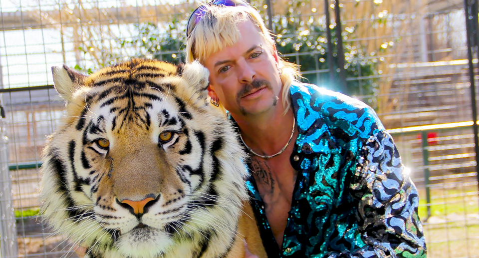 A Netflix publicity shot of Joe Exotic with a tiger.