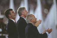 <p>Clinton, flanked by the presidents of the Atlanta Committee of the Olympic Games and the International Olympic Committee, looks on during the 1996 Opening Ceremony. (Getty) </p>