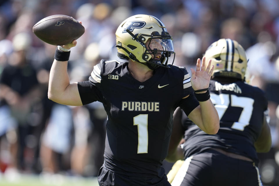 Purdue quarterback Hudson Card (1) throws against Notre Dame during the first half of an NCAA college football game in West Lafayette, Ind., Saturday, Sept. 14, 2024. (AP Photo/Michael Conroy)