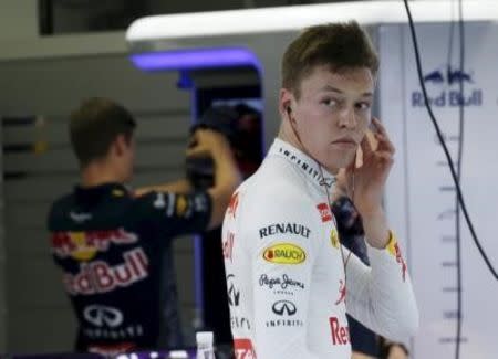 Red Bull Formula One driver Daniil Kvyat of Russia prepares for the third practice session of the Singapore F1 Grand Prix at the Marina Bay street circuit September 19, 2015. REUTERS/Edgar Su