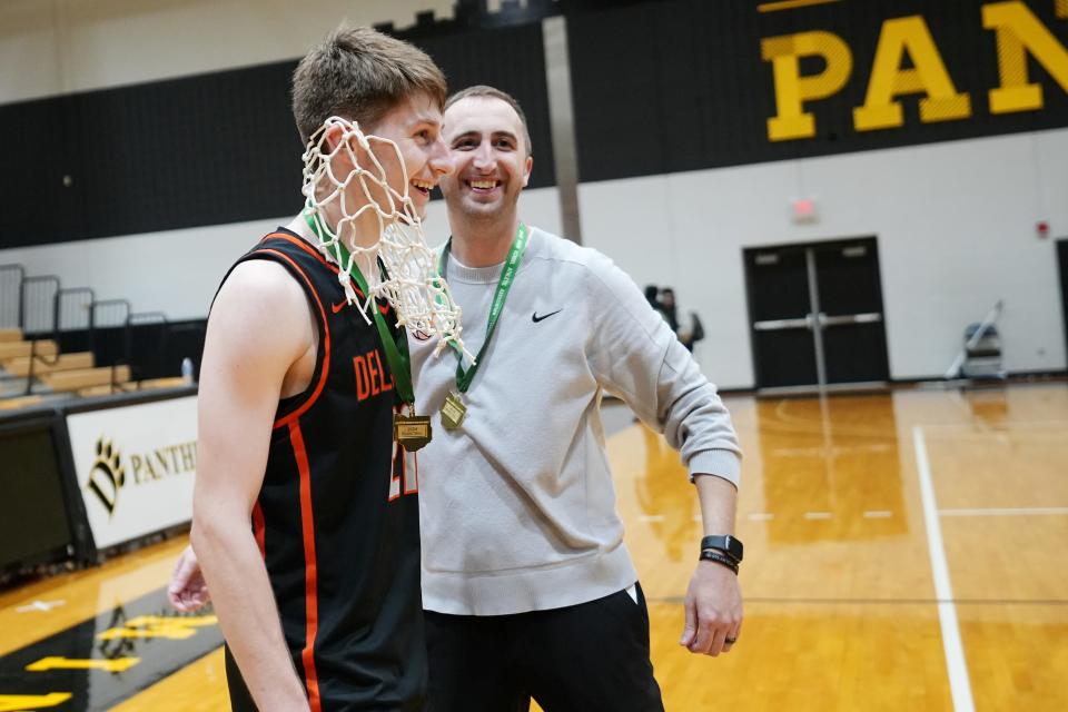 Delaware Hayes coach Adam Vincenzo puts the net over Jesse Burris after winning the Division I regional final against Olentangy Orange on Saturday at Ohio Dominican.