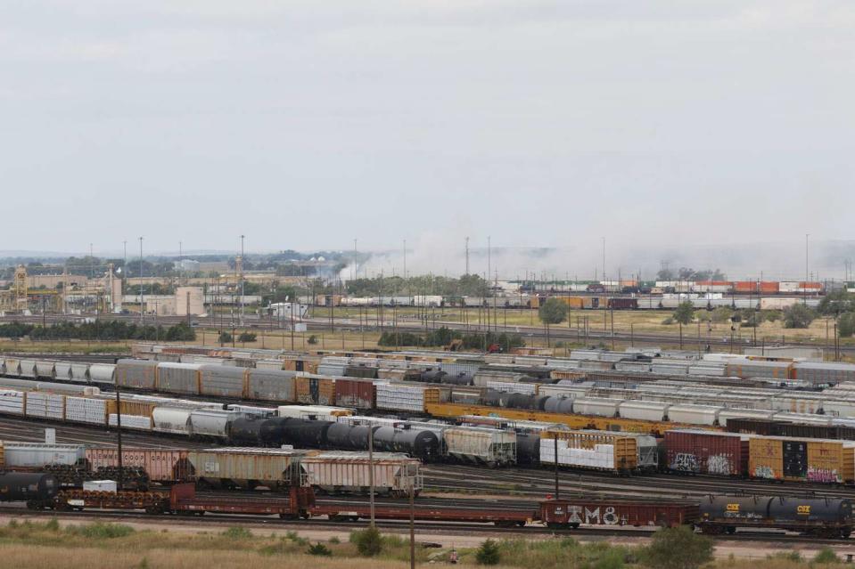 <p>Ryan Herzog/The Telegraph via AP</p> Smoke emanates from Union Pacific