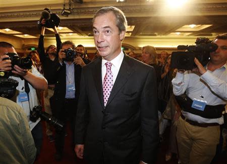 The leader of the UK Independence Party (UKIP), Nigel Farage, arrives to speak at the party's annual conference in central London September 20, 2013. REUTERS/Luke MacGregor