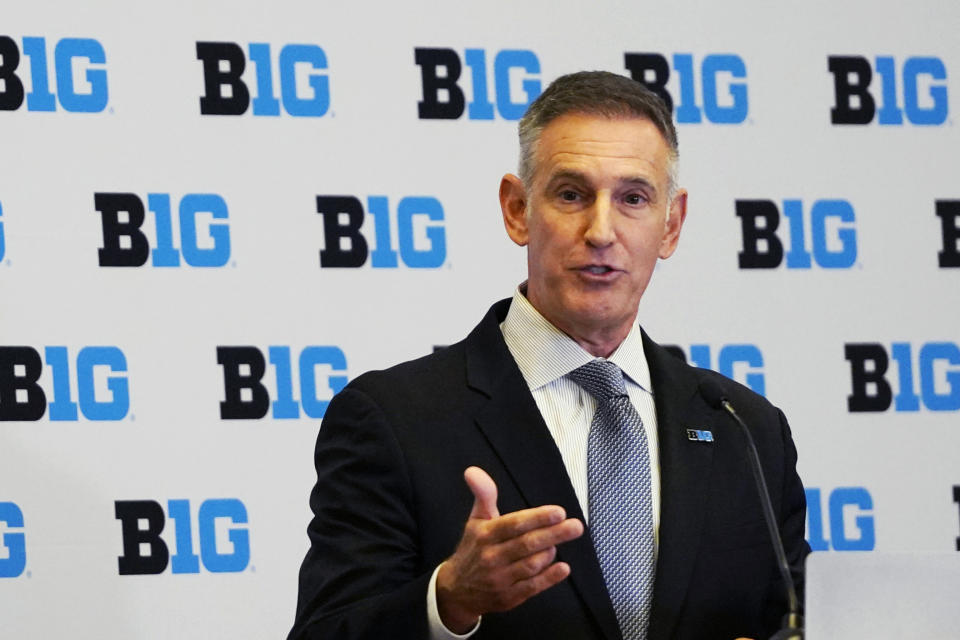 FILE - Tony Petitti speaks to the media as he's introduced as the commissioner of the Big Ten, April 28, 2023, in Rosemont, Ill. The NCAA and the nation's five biggest conferences have agreed to pay nearly $2.8 billion to settle a host of antitrust claims,a monumental decision that sets the stage for a groundbreaking revenue-sharing model that could start directing millions of dollars directly to athletes as soon as the 2025 fall semester. (AP Photo/David Banks, File)