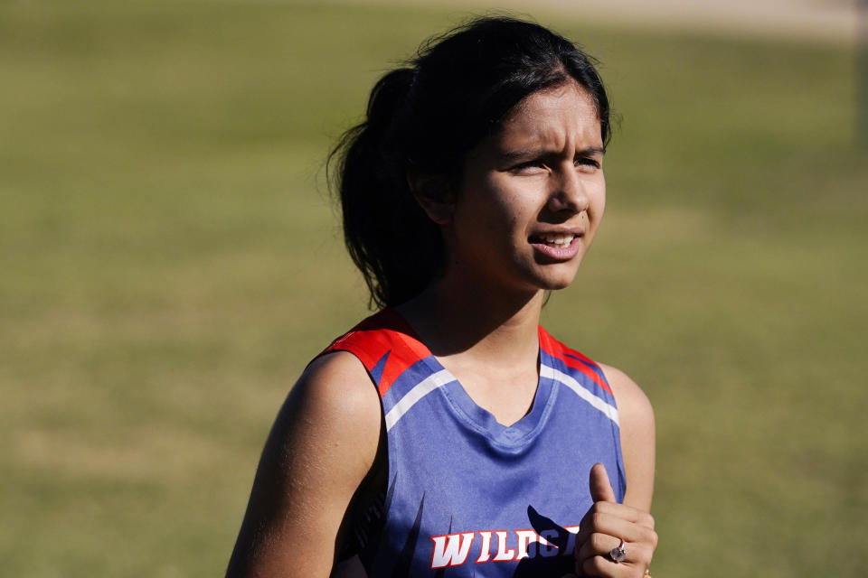 Diamond Figueroa, a sixth grader at Phoenix Christian School PreK-8, talks about her experience at the school during physical education class in Phoenix, Tuesday, Oct. 25, 2022. “Everyone here is so much nicer and welcoming," she said. “I am not afraid to ask questions.” (AP Photo/Ross D. Franklin)