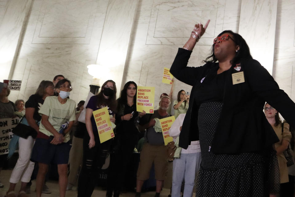FILE Democratic Del. Danielle Walker of Monongalia County speaks to a crowd protesting a sweeping abortion ban bill making its way through the West Virginia Legislature at the state Capitol on July 27, 2022 in Charleston, W.Va. (AP Photo/Leah Willingham, file)