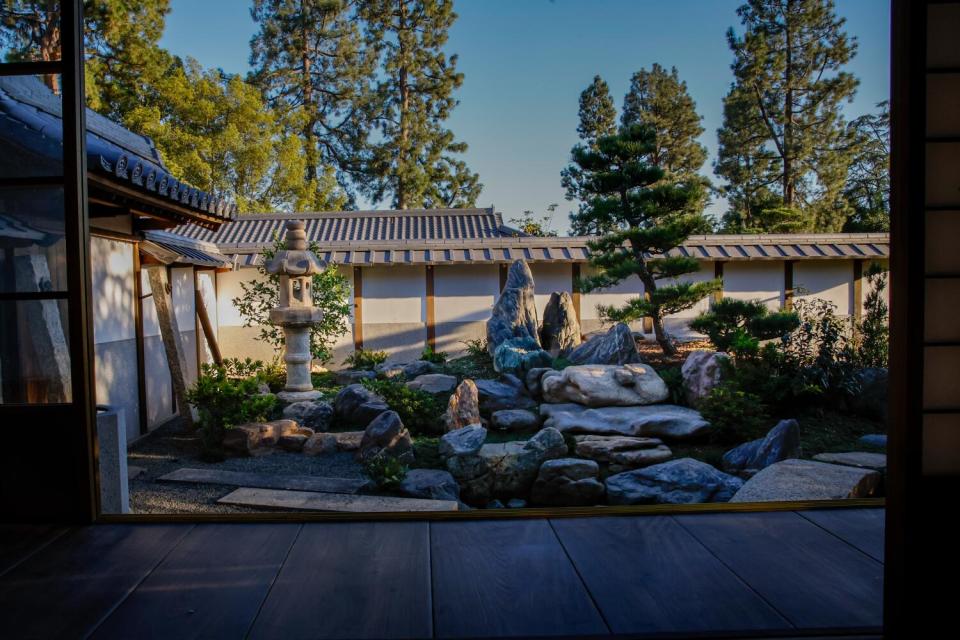 The exquisite Japanese garden of distinctive stones, pond, trees and shrubs outside the shōya's grand room for dignitaries.