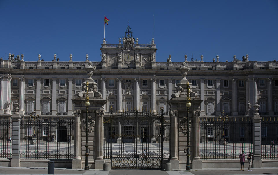 A view of the Royal Palace is pictured in Madrid, Spain, Tuesday, Aug. 4, 2020. Speculation over the whereabouts of former monarch Juan Carlos is gripping Spain, a day after he announced he was leaving the country for an unspecified destination amid a growing financial scandal. (AP Photo/Manu Fernandez)