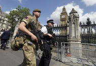 <p>A member of the army joins police officers in Westminster, London, May 24, 2017. Britons will find armed troops at vital locations Wednesday after the official threat level was raised to its highest point following a suicide bombing that killed more than 20, as new details emerged about the bomber. (Photo: Tim Ireland/AP) </p>