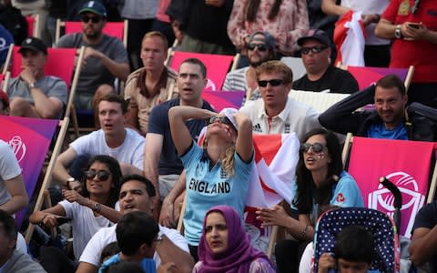 Tense fans watched on as Jofra Archer secured England victory in the super over - Credit: Chris Radburn/PA