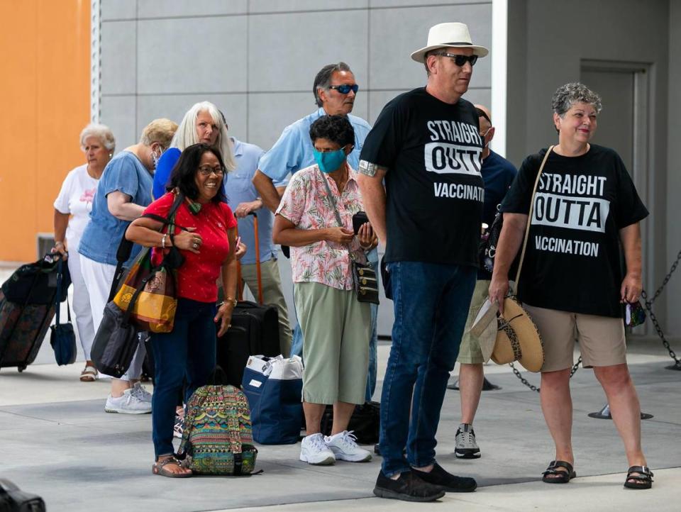 James and Cynthia Mitchell, far-right, from Hope, Kansas, wait in line to board Royal Caribbean’s Celebrity Edge cruise ship at Port Everglades Terminal 25 in Fort Lauderdale, Florida on Saturday, June 26, 2021. After departing Port Everglades Saturday, Celebrity Edge will be the first cruise ship sailing with guests from a U.S. port in over 15 months.