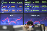 A currency trader watches monitors at the foreign exchange dealing room of the KEB Hana Bank headquarters in Seoul, South Korea, Thursday, June 24, 2021. Shares were mostly higher in Asia on Thursday after a listless day of trading on Wall Street as the recent bout of nerves over Federal Reserve policy fades. (AP Photo/Ahn Young-joon)