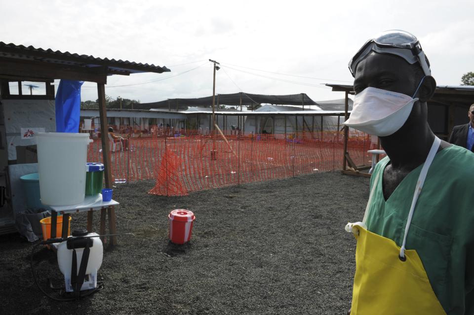 A Medicins Sans Frontieres (MSF) health worker stands outside the isolation unit during the visit of Senior United Nations (U.N.) System Coordinator for Ebola David Nabarro (not pictured) at ELWA hospital, in Monrovia August 23, 2014. As the outbreak has spread across borders from its initial epicentre in Guinea, governments in the region have introduced increasingly strict travel restrictions. Ivory Coast has closed its land borders Guinea and Liberia to try to prevent the virus from crossing onto its territory, the government announced late on Friday. REUTERS/2Tango (LIBERIA - Tags: HEALTH SOCIETY DISASTER)