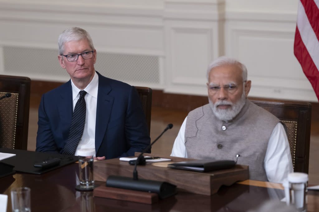 Tim Cook, chief executive officer of Apple Inc., left, and Narendra Modi, India's prime minister, during an event with US President Joe Biden, not pictured, senior officials and chief executive officers in the East Room of the White House in Washington, DC, US, on Thursday, June 22, 2023. The meeting is expected to cover innovation, investment and manufacturing in technology sectors including artificial intelligence, semiconductors, and space, according to the White House. Photographer: Chris Kleponis/CNP/Bloomberg via Getty Images