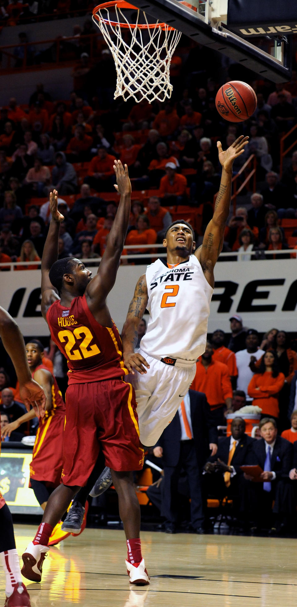 Oklahoma State Le'Bryan Nash (2) takes a shot over Iowa State forward Dustin Hogue (22) during an NCAA college basketball game in Stillwater, Okla., Monday, Feb. 3, 2014. Nash scored 26 points in the 98-97 win over Oklahoma State. (AP Photo/Brody Schmidt)