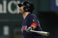 Boston Red Sox's J.D. Martinez watches his solo home run against the Texas Rangers during the first inning of a baseball game in Arlington, Texas, Saturday, May 14, 2022. (AP Photo/LM Otero)