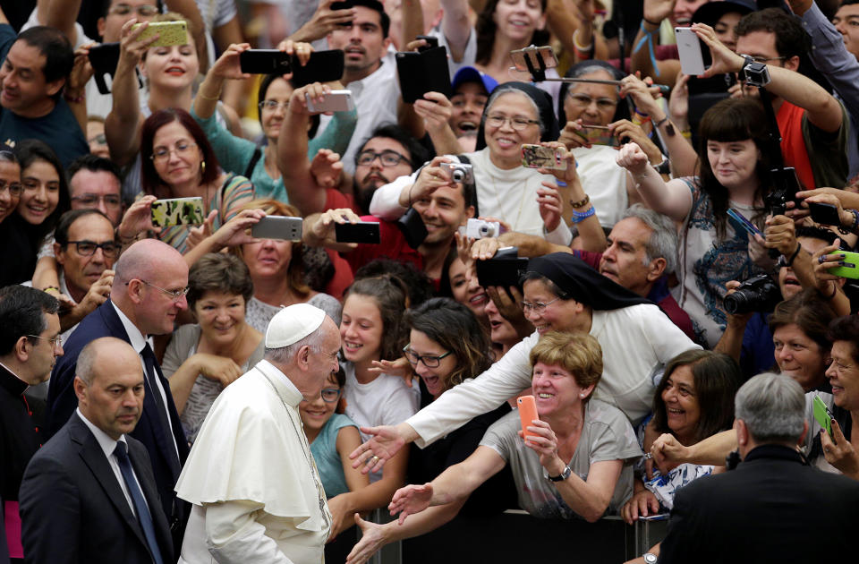 Pope Francis arrives to lead the weekly audience at the Vatican