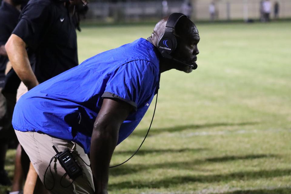 Palm Beach Gardens coach Tyrone Higgins waited eagerly on the sideline to flag the ref for a timeout as the game stood tied 14-14 in the fourth quarter.