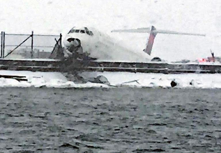 This image provided by @NYPDSpecialops shows Delta flight 1086 from Atlanta after it skidded off the runway on March 5, 2015 at La Guardia Airport in New York, during a heavy snow storm