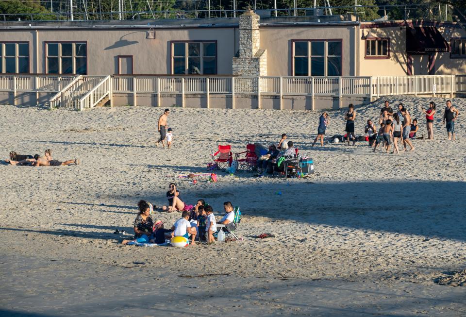 Groups of young people on the Monterey State Beach during the heatwave that struck Monterey County on Tuesday, May 26, 2020.