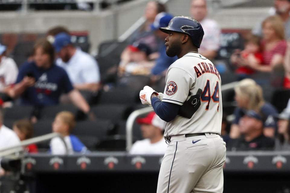 Houston Astros' Yordan Alvarez walks to first after being hit by a pitch by Atlanta Braves' Bryce Elder during the first inning of a baseball game Friday, April 21, 2023, in Atlanta. (AP Photo/Butch Dill)