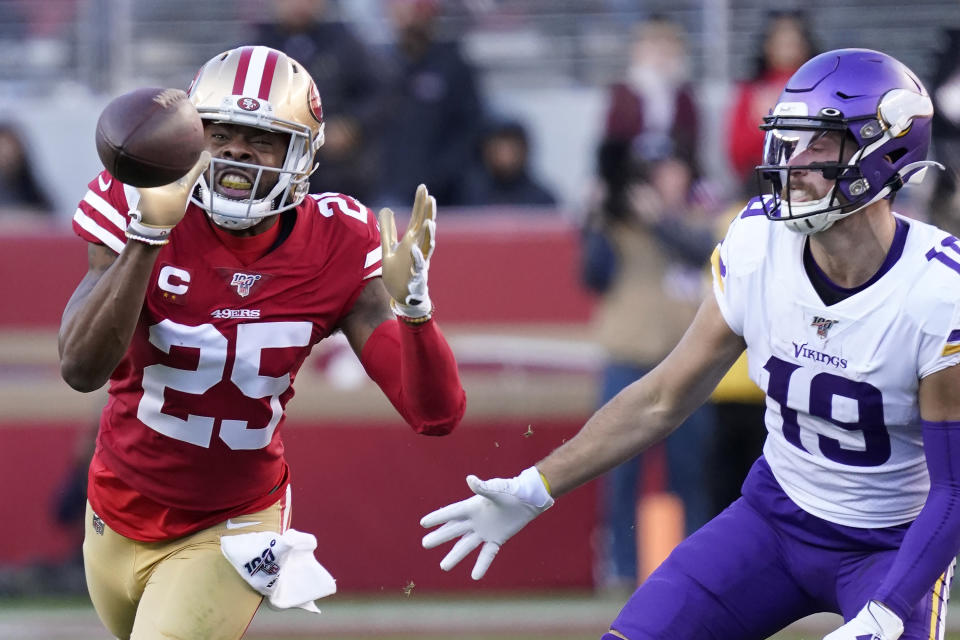 San Francisco 49ers cornerback Richard Sherman (25) intercepts a pass in front of Minnesota Vikings wide receiver Adam Thielen (19) during the second half of an NFL divisional playoff football game, Saturday, Jan. 11, 2020, in Santa Clara, Calif. (AP Photo/Tony Avelar)