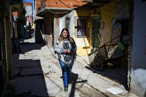 Dagna Avia walks through the poverty-hit Buenos Aires district of Villa 21-24 where her soup kitchen feeds 200 people a day