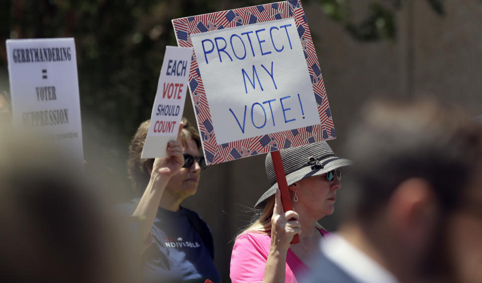 Protesters gather outside the federal courthouse, Monday, July 10, 2017, in San Antonio, where a redistricting trial is taking place. Federal courts earlier this year found that Texas passed election laws to purposefully discriminate against Hispanic and black voters, and the trial starting now could redraw Texas voting maps before 2018 and bolster Democratic efforts to reclaim Congress. (Photo: Eric Gay/AP)