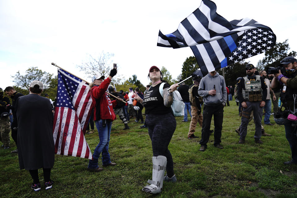 Members of the Proud Boys and other right-wing demonstrators rally on Saturday, Sept. 26, 2020, in Portland, Ore. (AP Photo/John Locher)